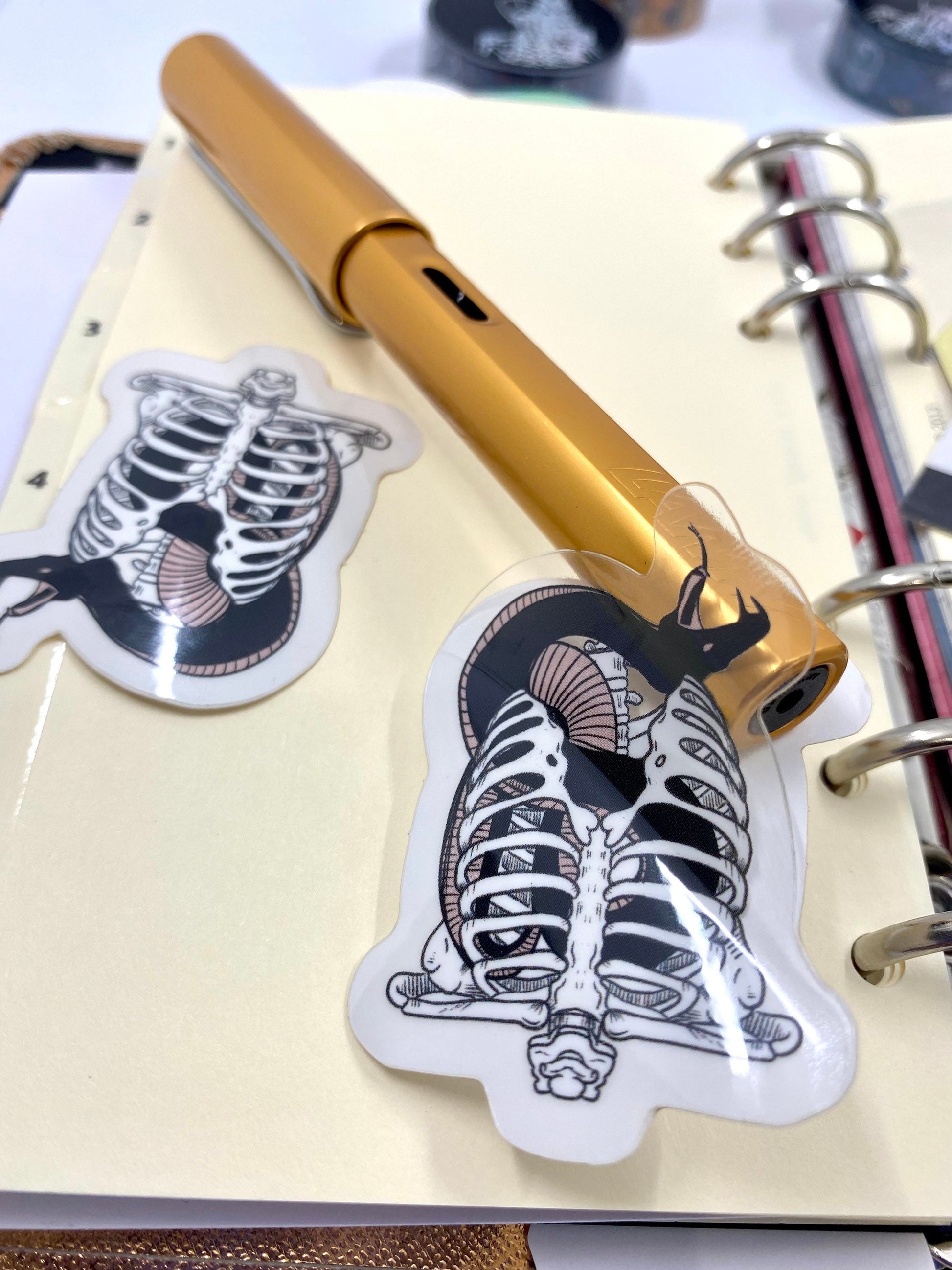 Snake in a Ribcage vinyl sticker pack of 2. With transparent effect vinyl.