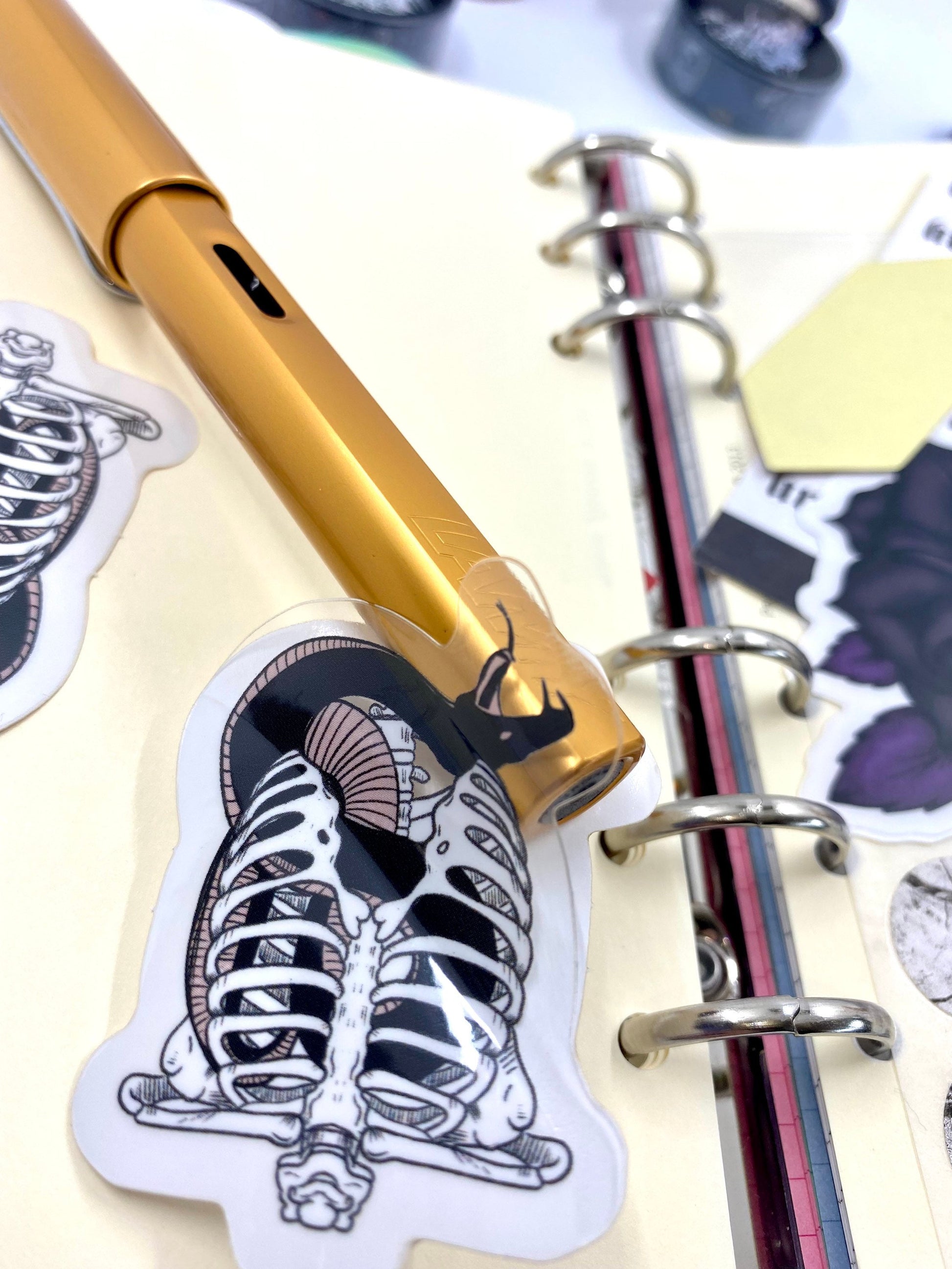 Snake in a Ribcage vinyl sticker pack of 2. With transparent effect vinyl.